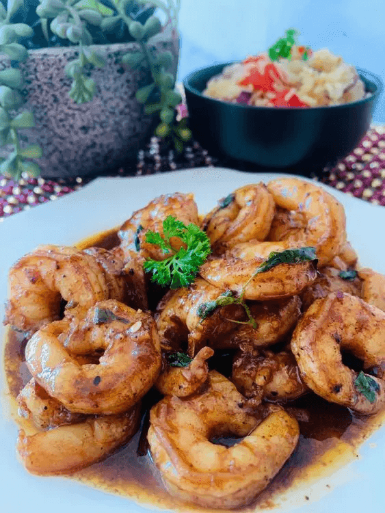 A serving of Glazed Prawns in a plate.