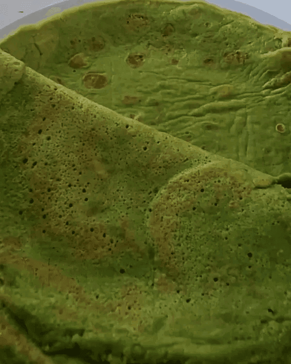 Spinach crepes served on a plate.