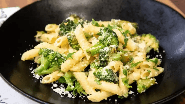 Freshly cooked Broccoli and Pea Pasta with Herb Sauce served in a plate.