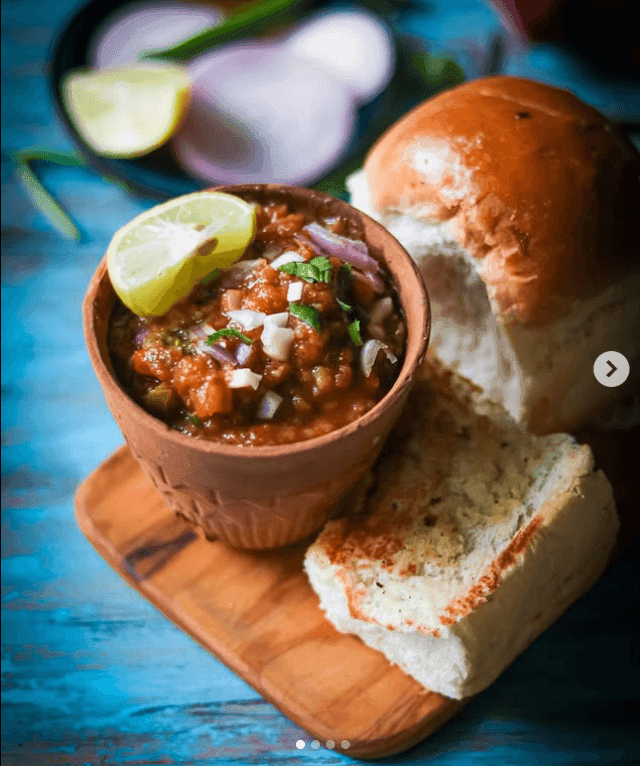 Delicious Pav Bhaji garnished and served
