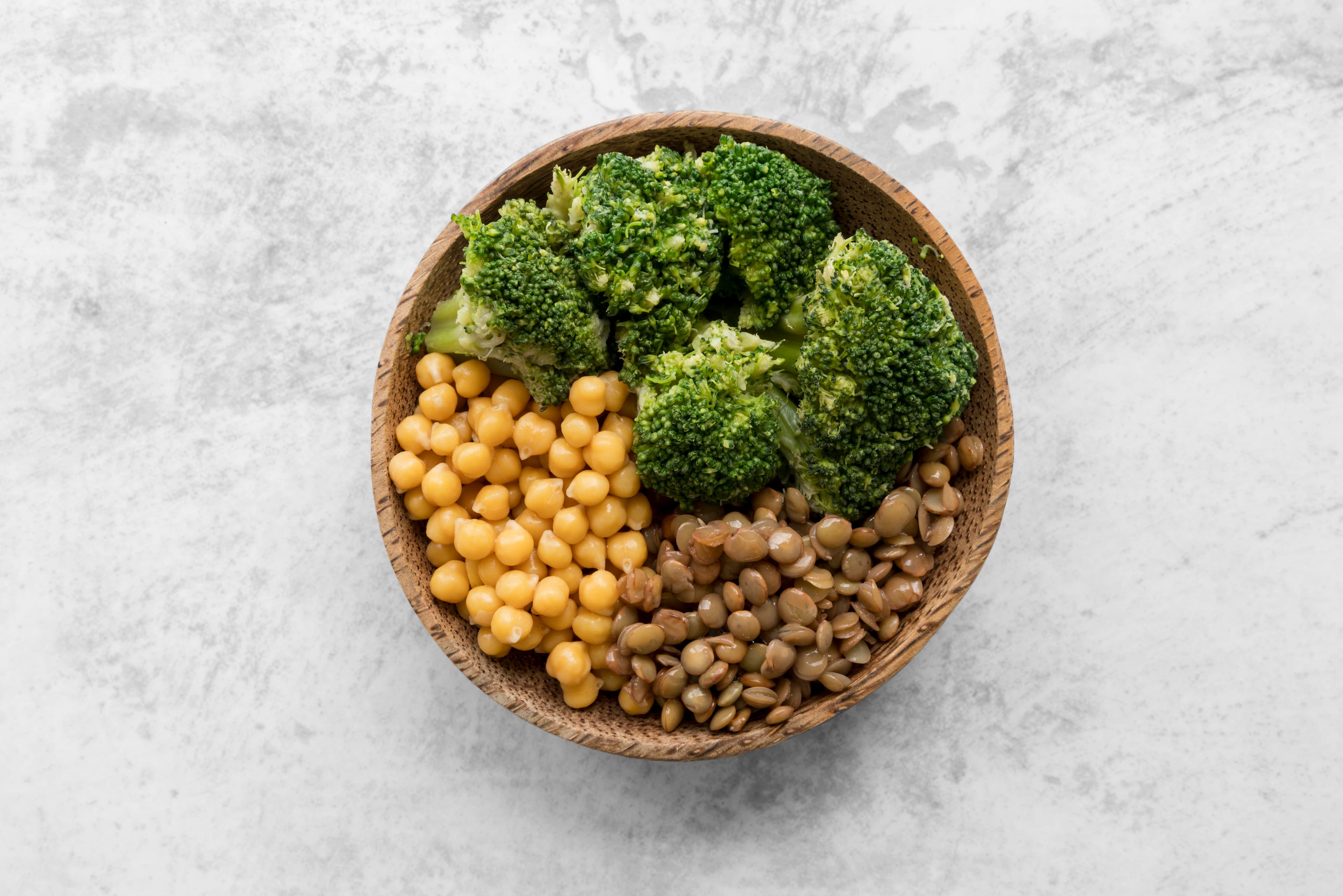 Plant-based Protein sources like chickpea and broccoli placed in a bowl
