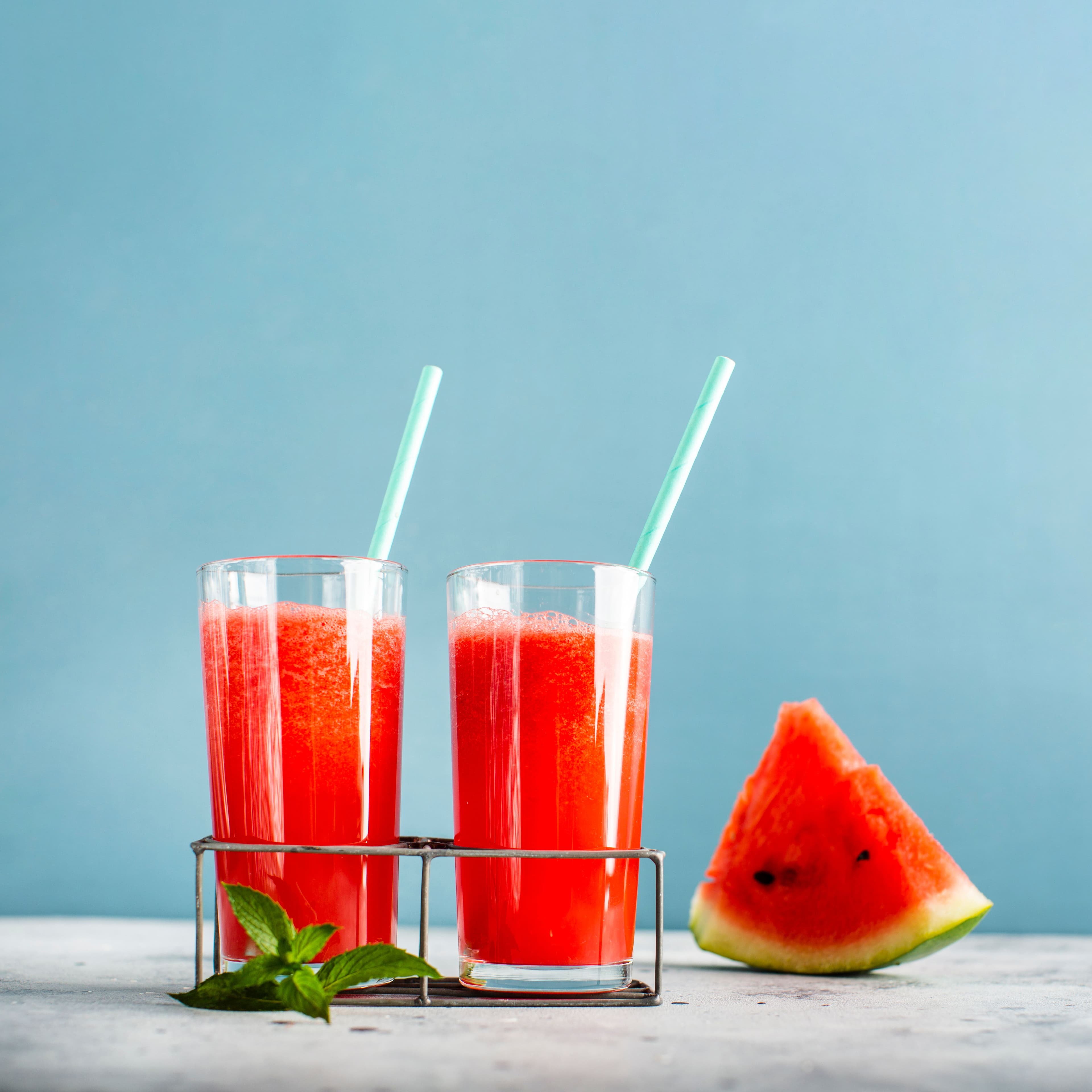 two-glasses-with-watermelon-juice-slice-beside
