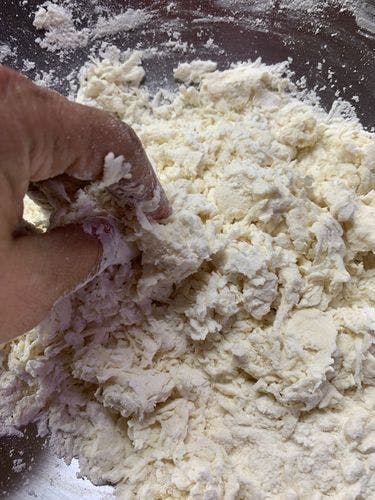 Chicken-Stuffed-Baida-Roti-Flour-Mixing-With-Fingers.jpg