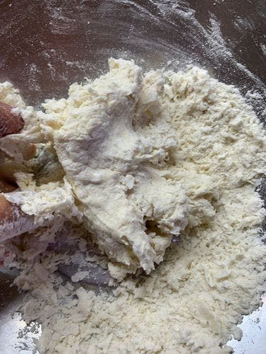 Chicken-Stuffed-Baida-Roti-Flour-Mixing-With-Fingers (2).jpg