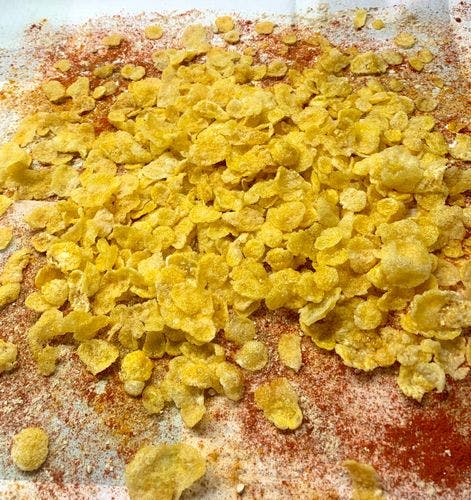 Cornflakes-Mixture-(Namkeen)-Expanded-Cornflakes-With-Sprinkled-Spices-On-Paper-Towel.jpg