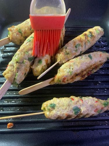 Grilled-Chicken-Kebab-Brushing-Oil-on-Sides-of-Kebab.jpg