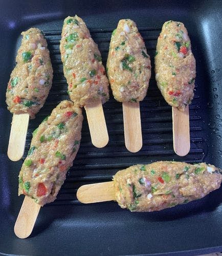 Grilled-Chicken-Kebab-Threaded-Chicken-Mince-Sticks-on-Grill-Pan.jpg