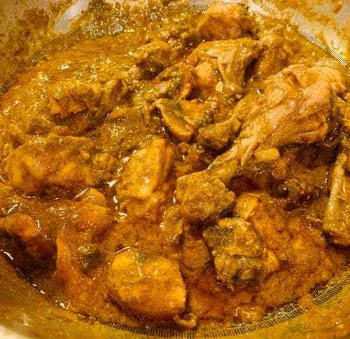 Cooked chicken curry in a pan