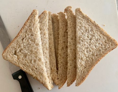 8 pieces of brown bread sliced into large triangles