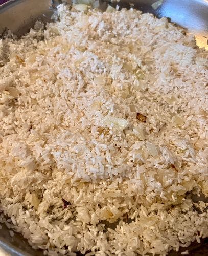 Step 1.2: Add the rice and coconut shreds