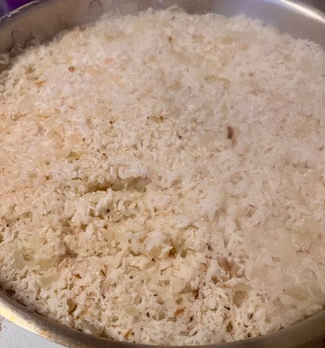 Step 1.2: Add the coconut milk and 2 cups of water, making sure all the rice is evenly covered