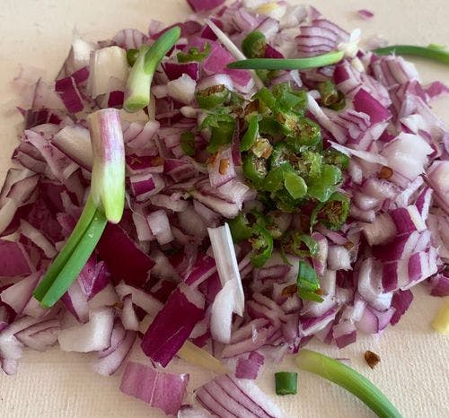 Chopped onions and green chillies.