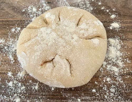 Stuffed dough ball with dusted flour