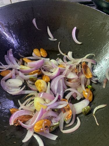 Paneer-Veggie-Kofta-Curry-Sauteed-Onion-Almonds-in-Wok.jpg