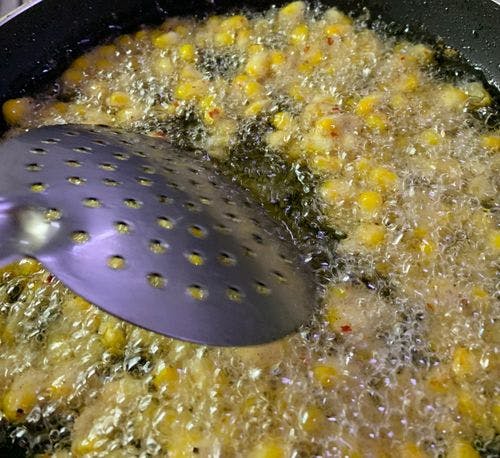 Spicy-Fried-Corn-Ladle-Corn-Kernels-in-Oil.jpg