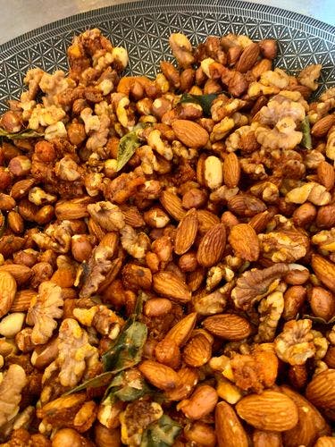 Mixture of spices and nuts in a pan
