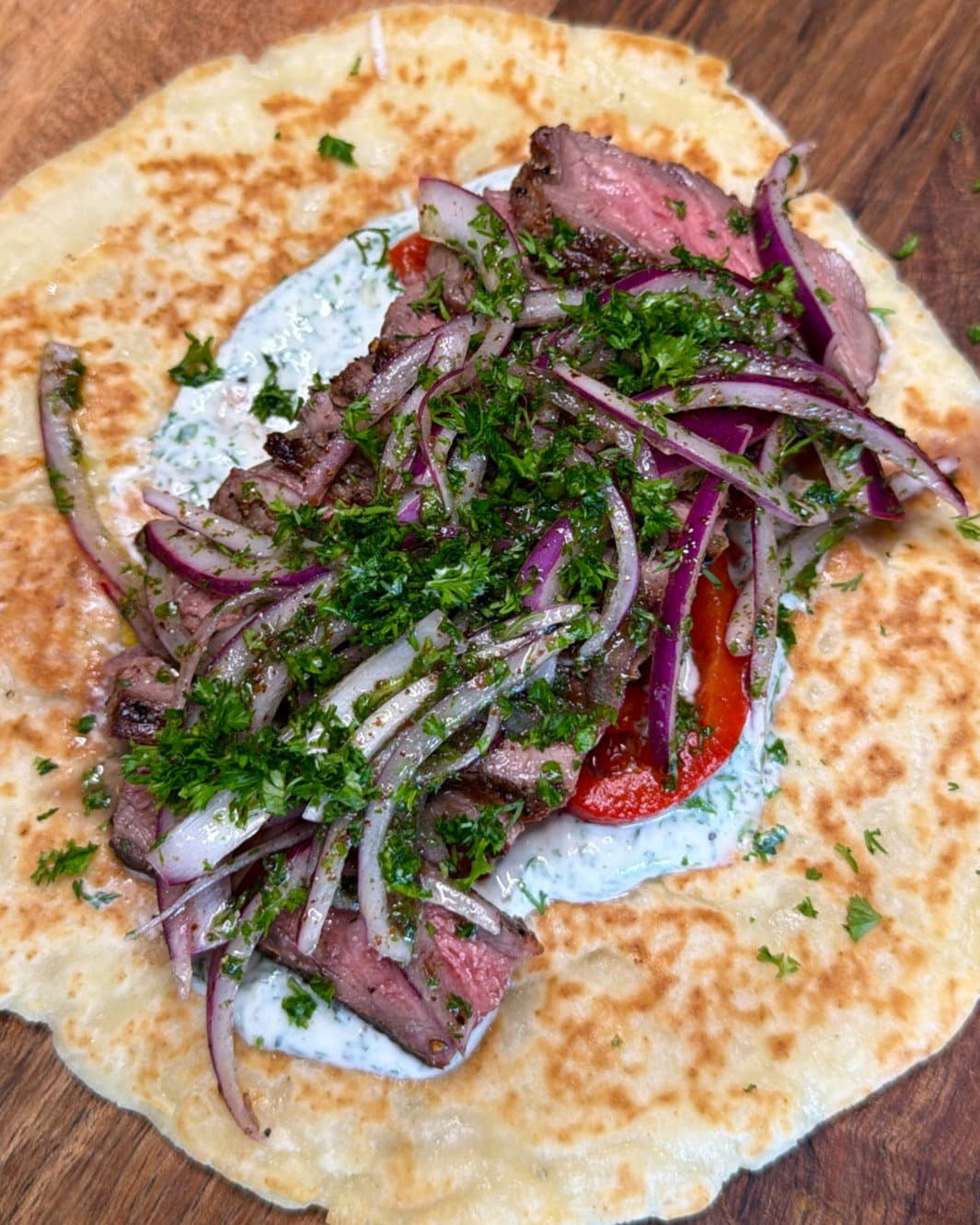 Mediterranean Steak Flat Bread with Sumac Onion Salad & Garlic Yoghurt Sauce recipe