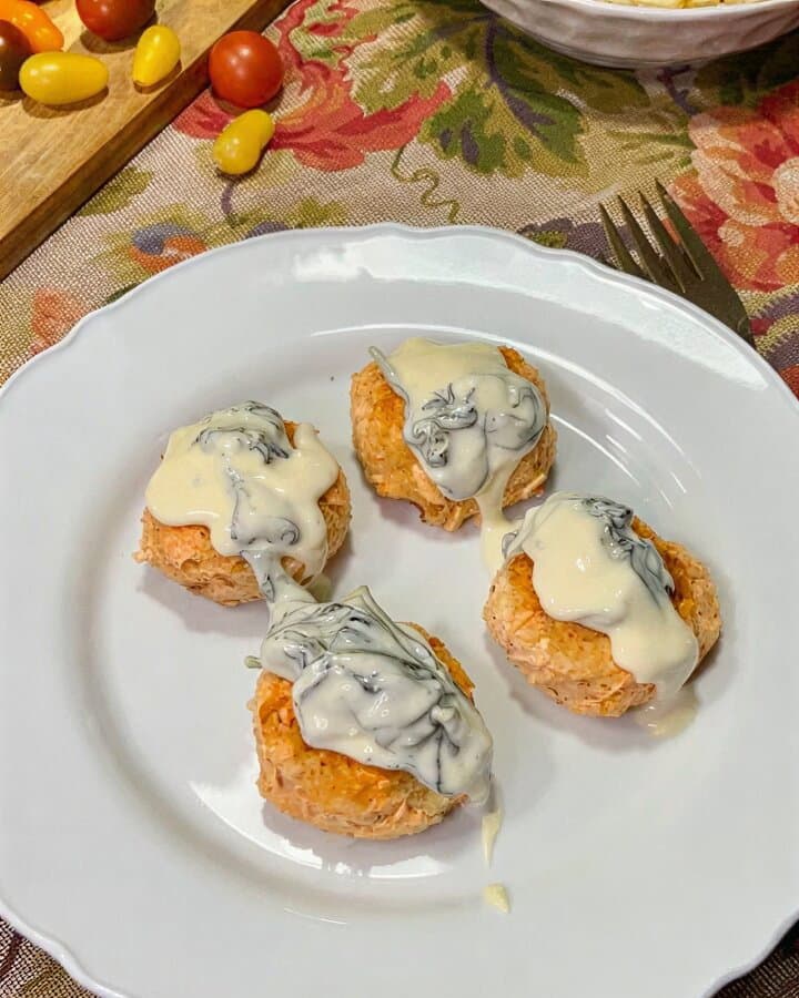 Perfectly Flaky Salmon Cakes with Creamy Parmesan Spinach Sauce recipe
