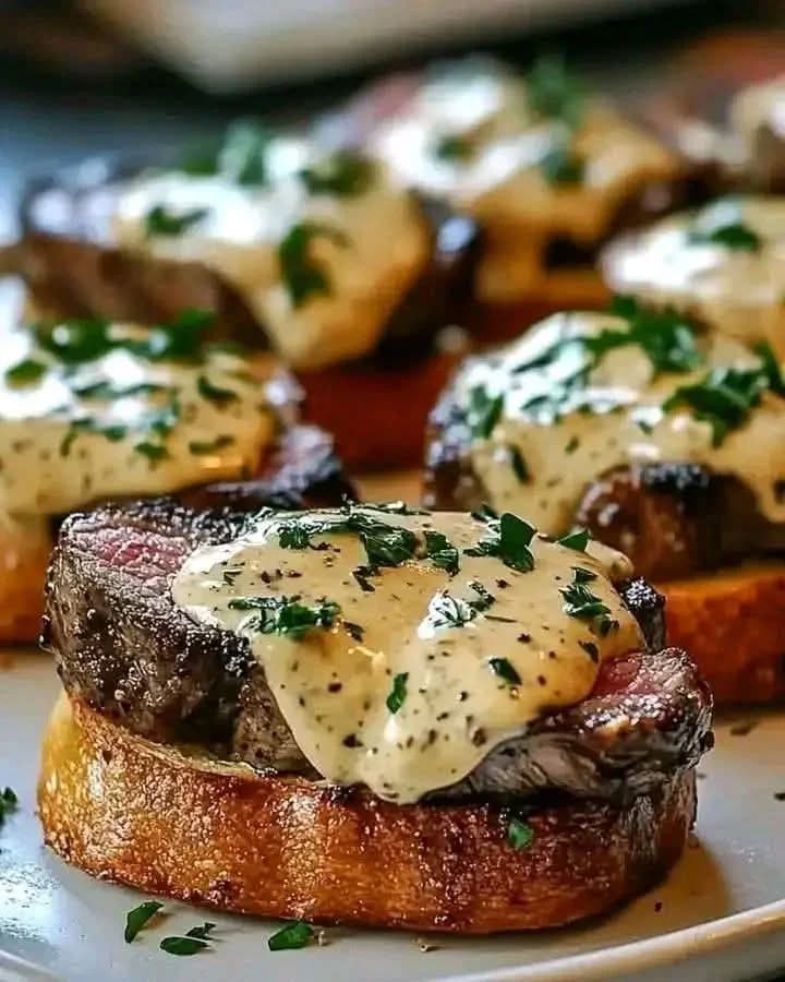 Beef Tenderloin Crostini with Parmesan Cream Sauce recipe
