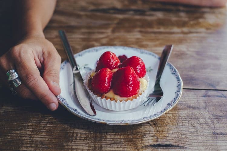 A delicious sugar-free strawberry tart on a plate, ready to be enjoyed