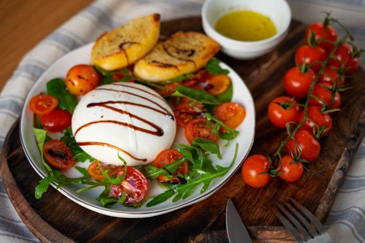 burrata and grape tomato salad with garlic bread