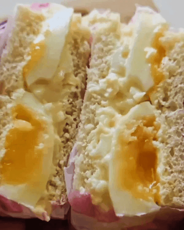 A close-up of a sliced Japanese Egg Sandwich.