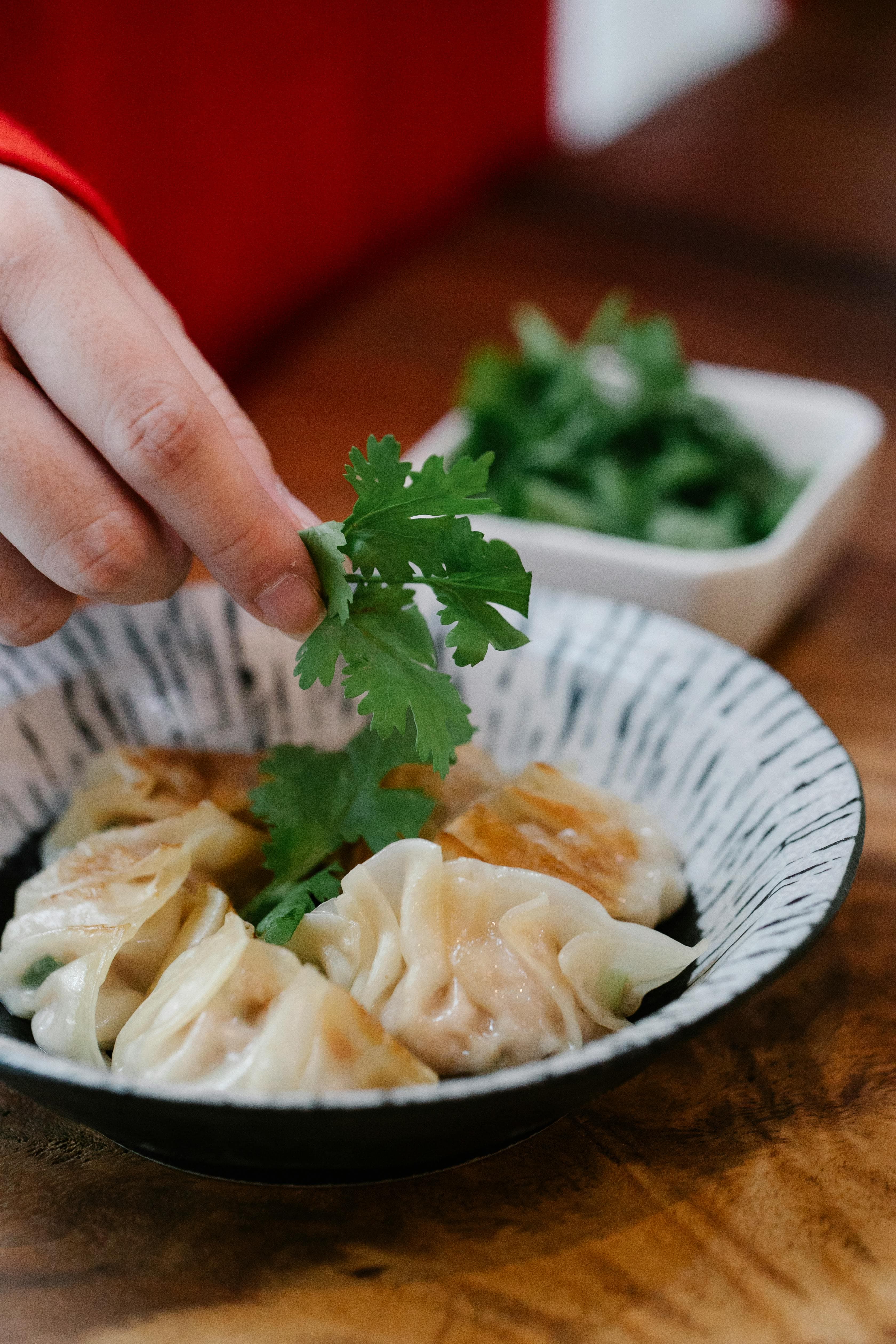 Coriander leaves being used as a garnish.