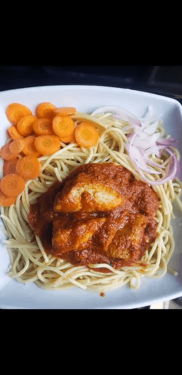 A close-up of a plate containing Nigerian Chicken Stew.