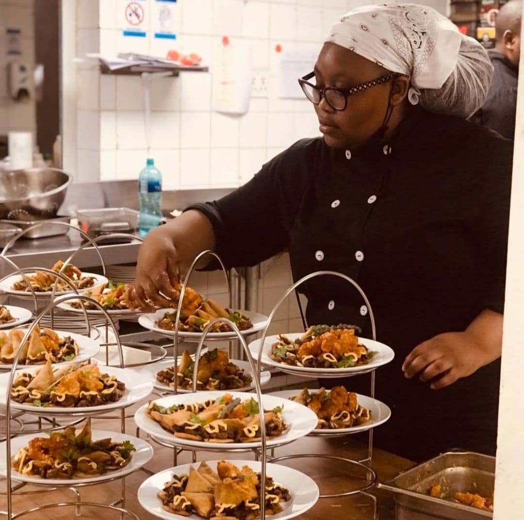 Renowned food content creator Lindokuhle Mfana arranging her dishes
