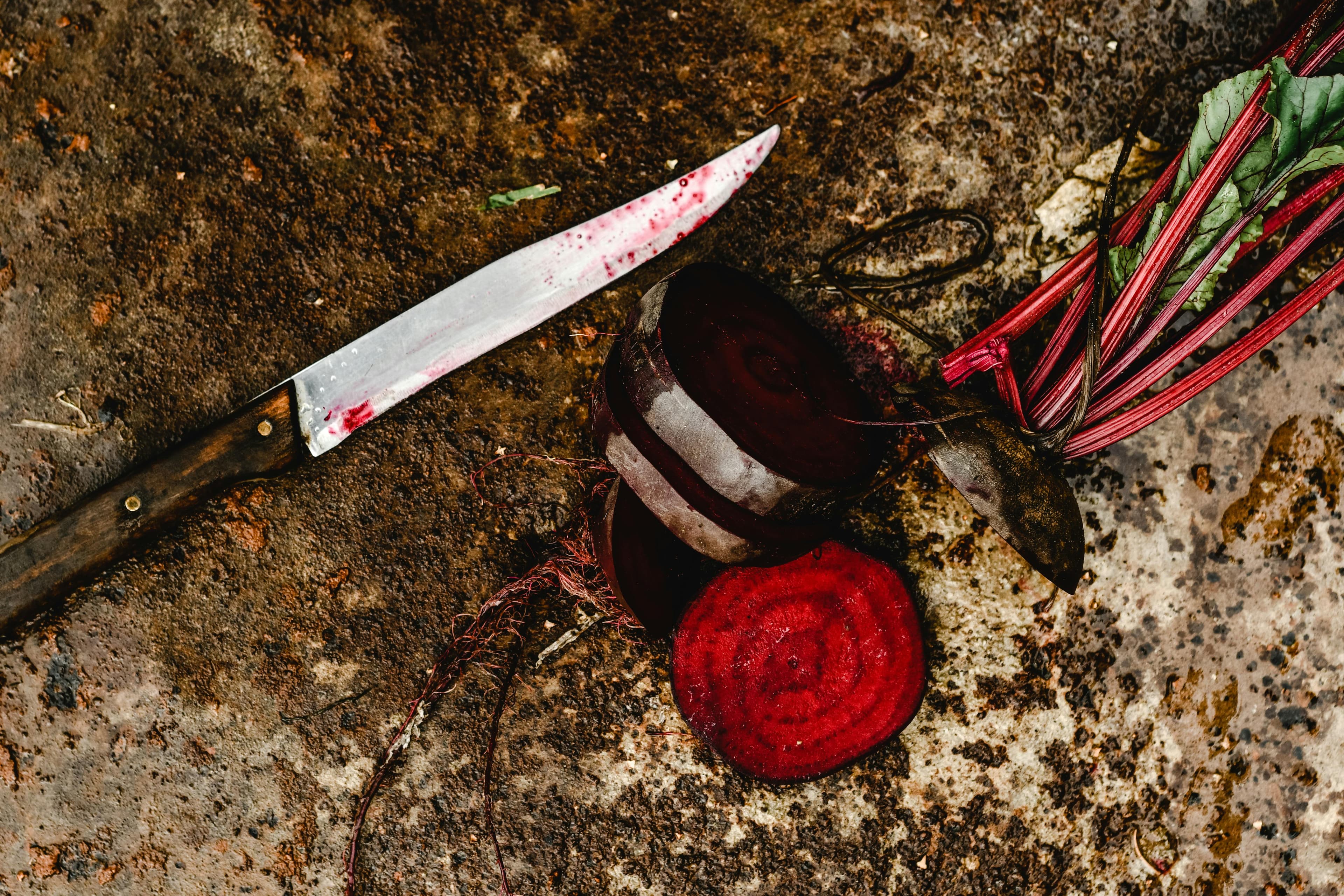 A close-up of freshly sliced beetroot showcasing its vibrant ruby-red colour and concentric ring pattern.