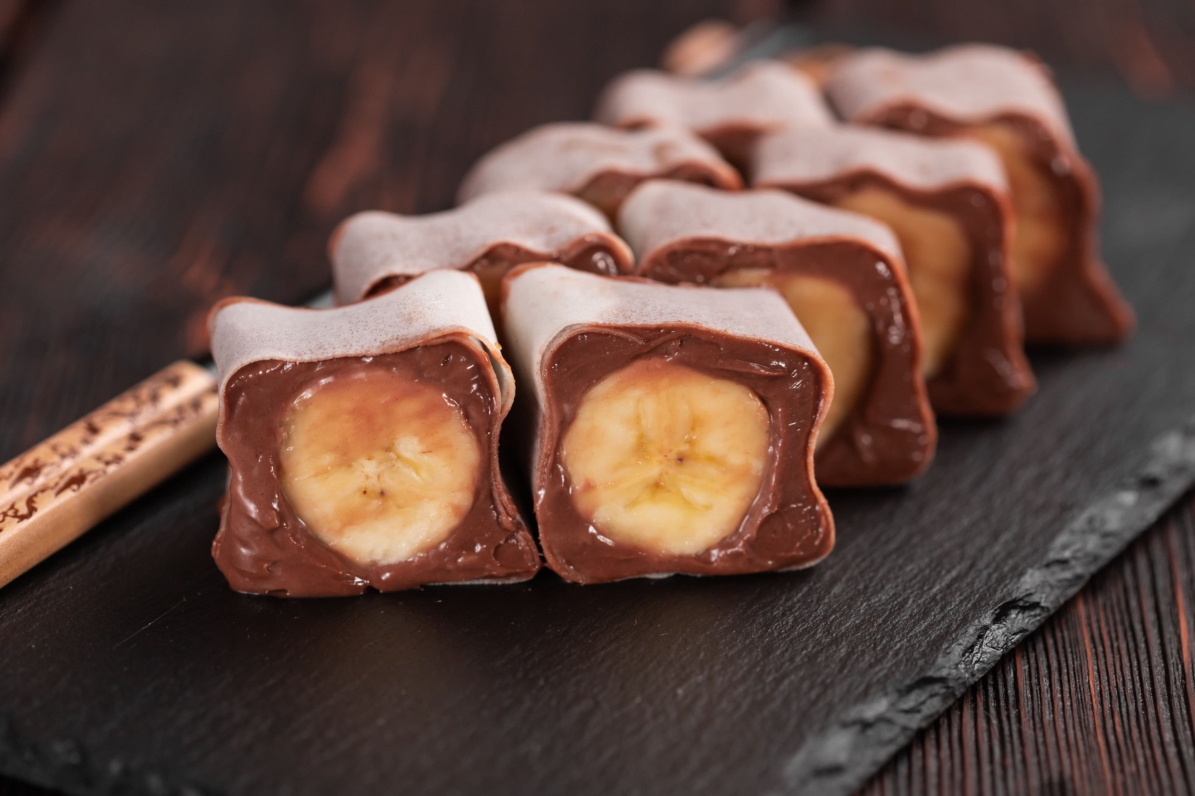 Close-up of banana chocolate dessert.