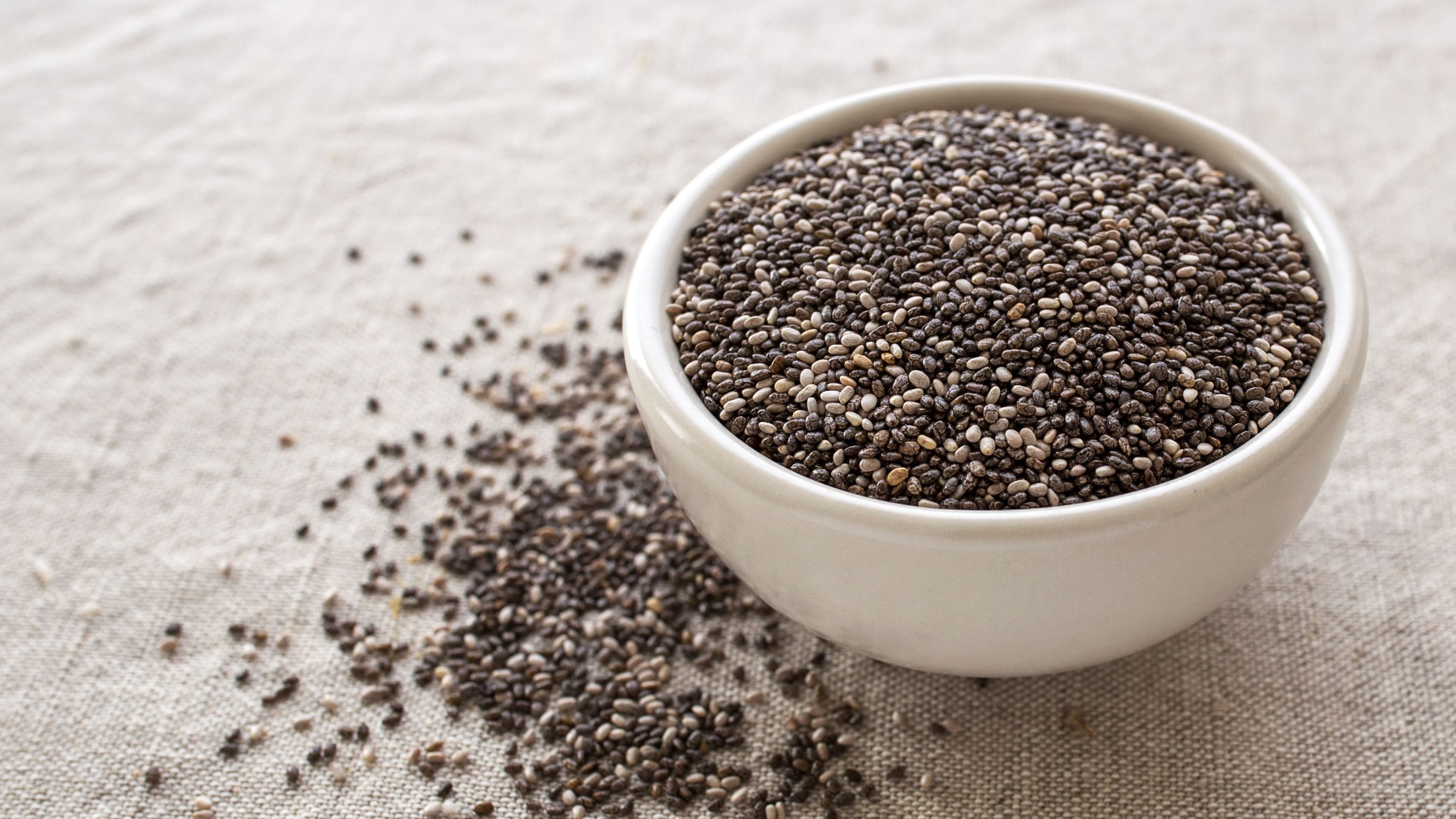 Close-up of chia seeds, a nutrient-dense superfood commonly used in healthy snacking recipes.