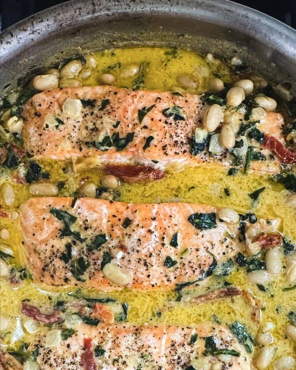 Weeknight Tuscan Salmon with Beans, Spinach, and Sun-Dried Tomato Sauce recipe