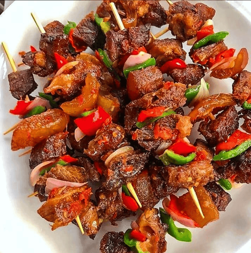 Assorted Nigerian-style grilled meat skewers with peppers and onions by SB Treats