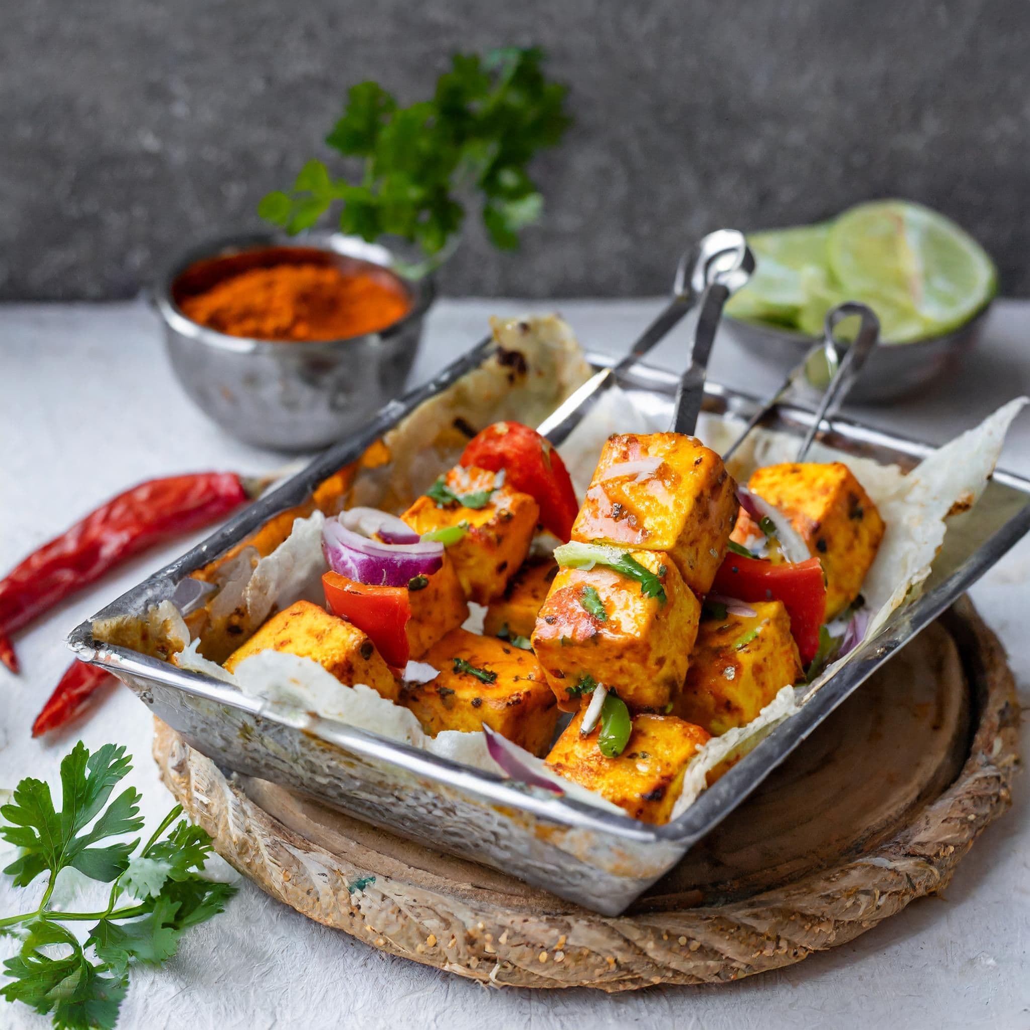 paneer-tikka-is-indian-cuisine-dish-with-grilled-paneer-cheese-with-vegetables-spices-indian-food.jpg