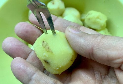 Creamy-Baby-Potato-Curry-(Dum-Aloo)-Prick-Baby-Potato-With-Fork.jpg