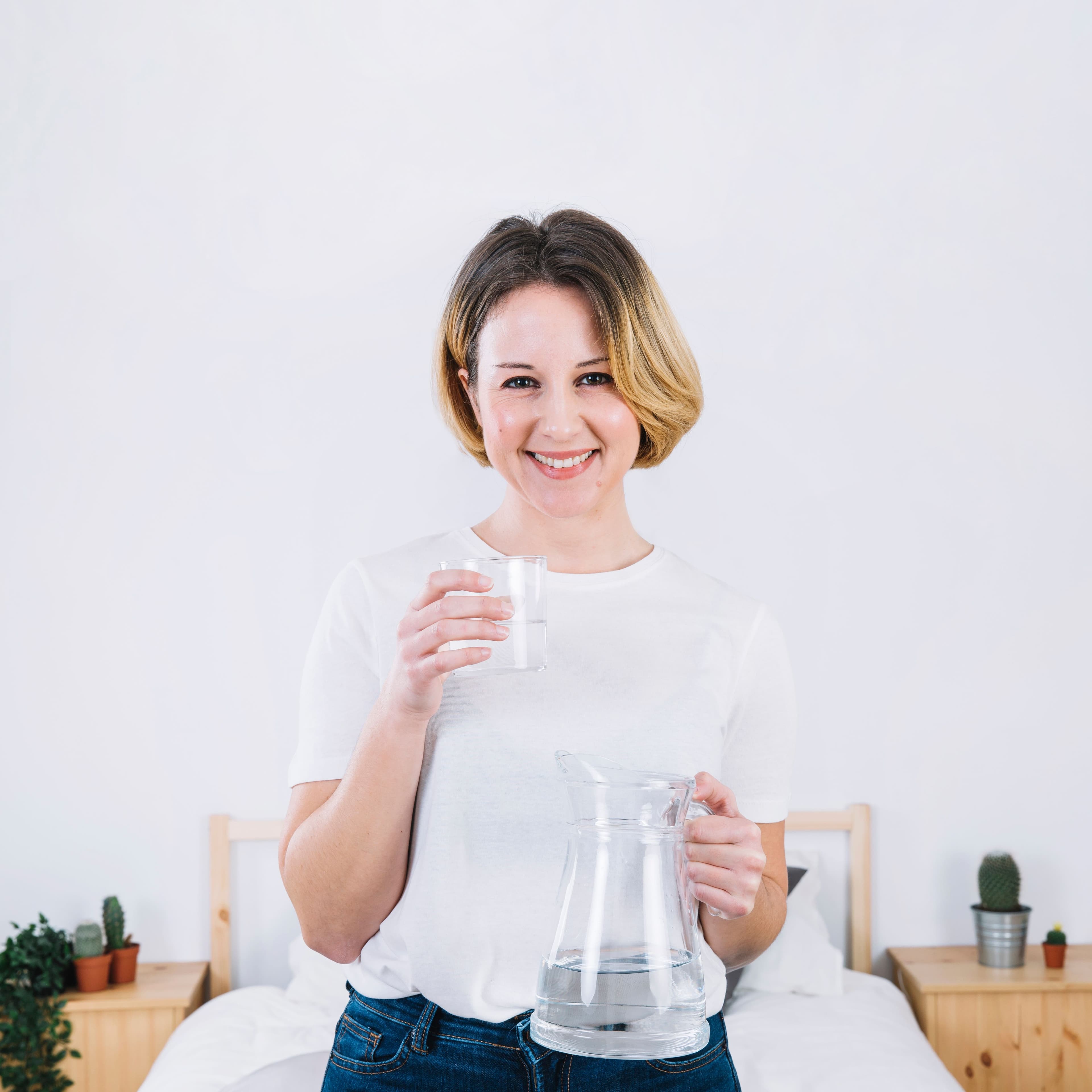 woman-with-glass-jug-bedroom.jpg