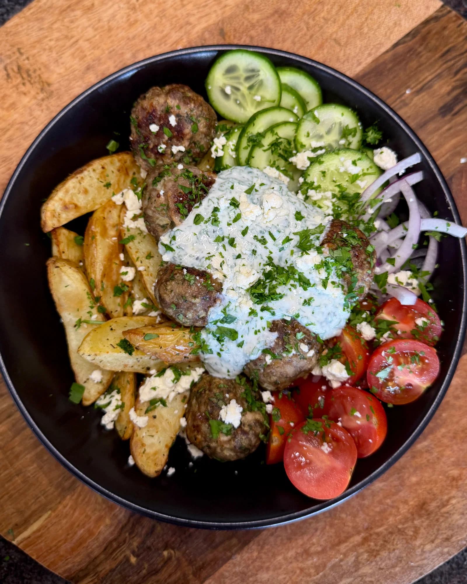 Mediterranean Beef Meatballs with Potato Wedges and Garlic Yoghurt Sauce recipe
