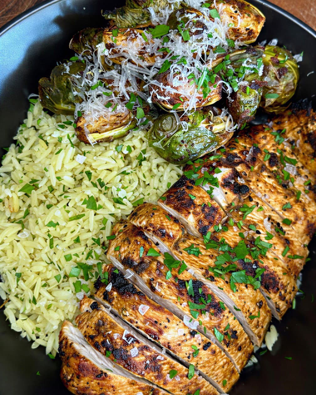 Grilled Chicken with Lemon Herb Rice and Crispy Parmesan Brussels Sprouts recipe